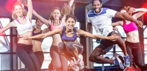 group of people in the gym jumping